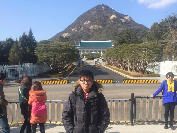 Me in front of the blue house